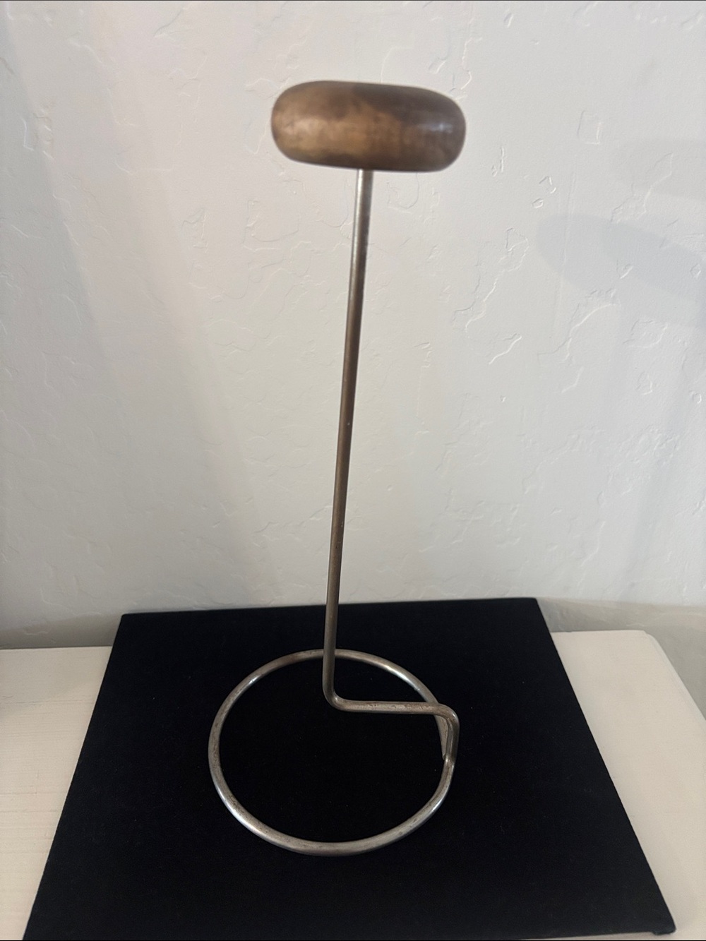 Vintage metal hat stand with wood top